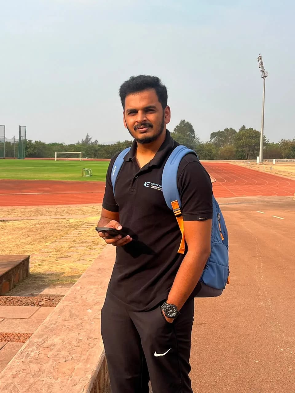 A Kinetic Edge coach at the athletics track